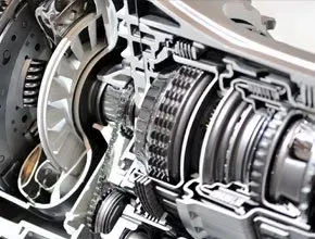 Cutaway view of an automotive transmission, showcasing gears, clutch plates, and internal components.