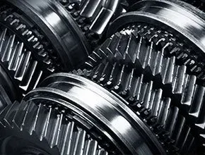Close-up of interlocking metal gears, showing precision machinery and metallic textures.