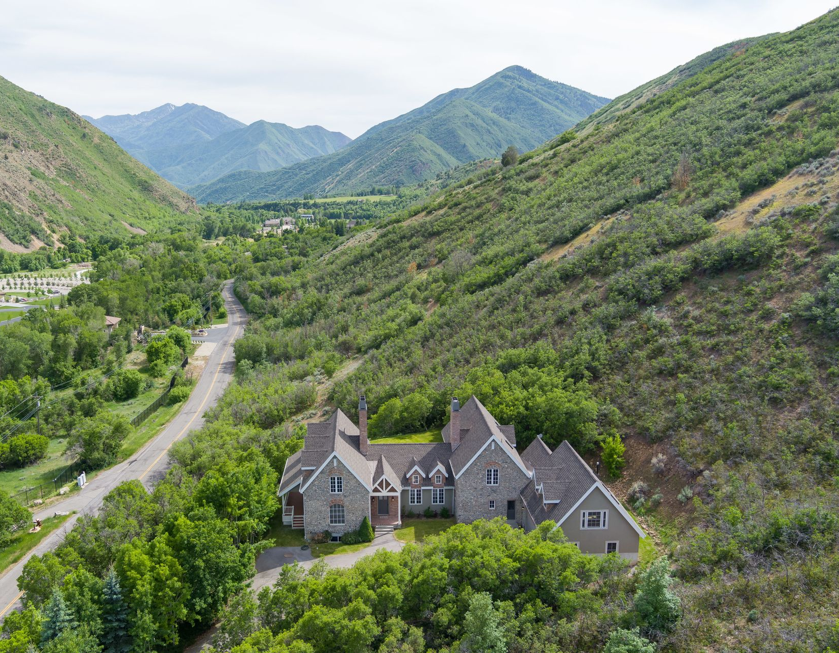 Sandstone canyon walls in shades of brown and orange, with sunlight filtering from above.