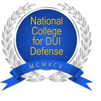 National College for DUI Defense logo with silver laurel wreath and blue ribbon