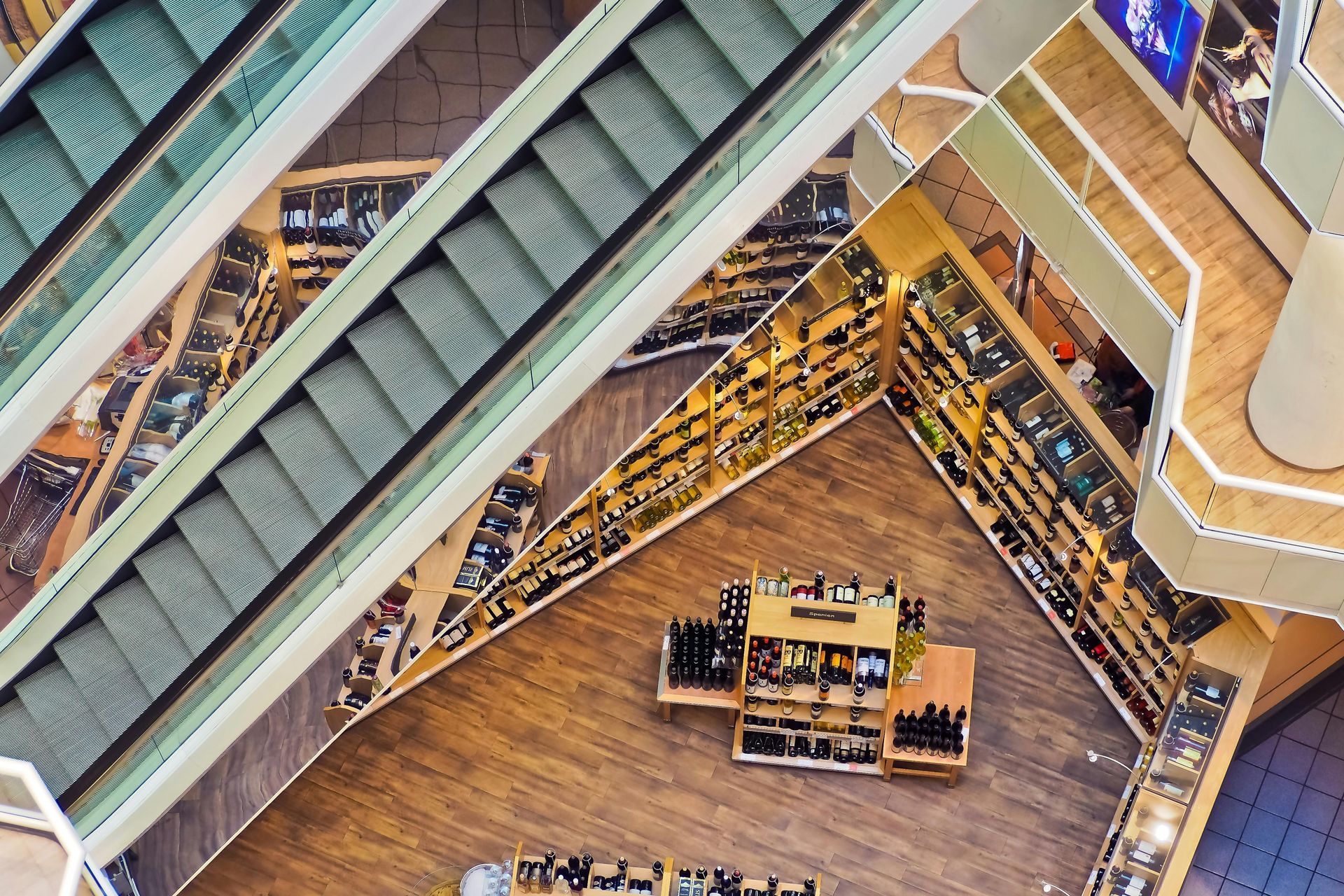 An aerial view of an escalator in a shopping mall.