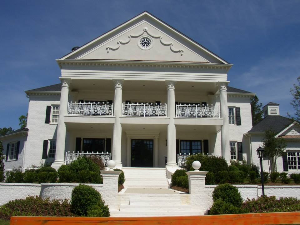 A large white house with columns and balconies