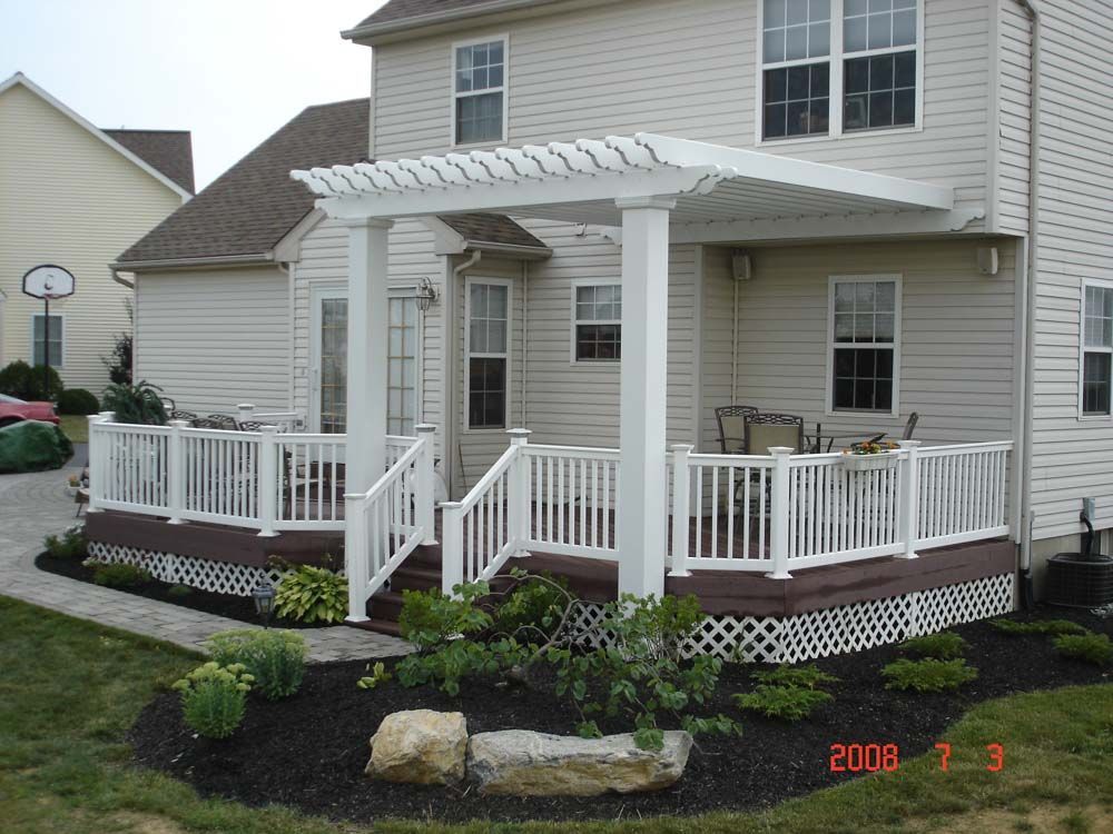A house with a deck and a pergola taken in 2006