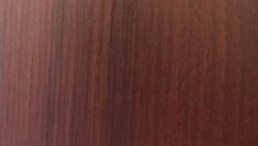 A close up of a piece of wood showing the grain of the wood.