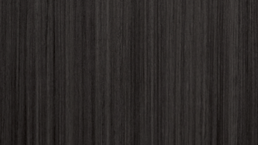 A close up of a dark wood grain texture.
