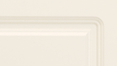 A close up of a white door with a corner.