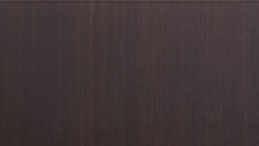 A close up of a dark brown wood grain texture.