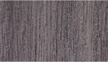 A close up of a gray wood grain texture.