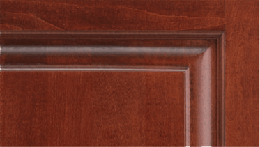 A close up of a wooden door with a wooden frame.