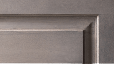 A close up of a gray door with a metal frame