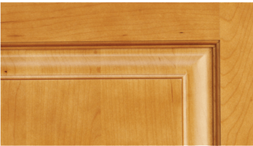 A close up of a wooden door with a trim