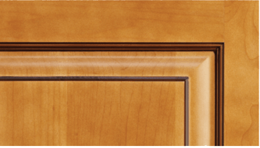 A close up of a wooden door with a brown trim