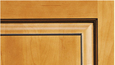 A close up of a wooden door with a black trim