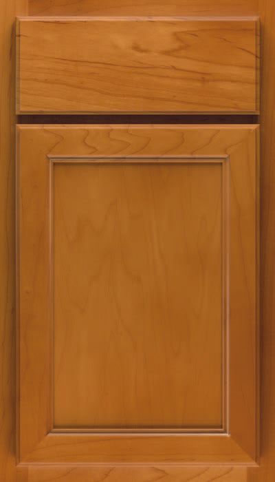 A close up of a wooden cabinet door with a drawer.