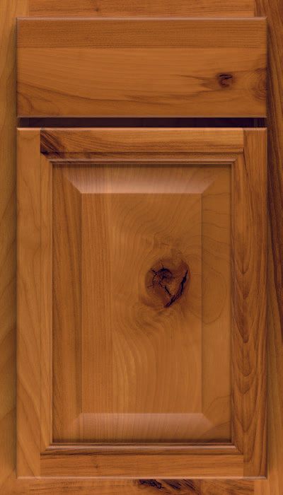 A close up of a wooden cabinet door with a drawer.