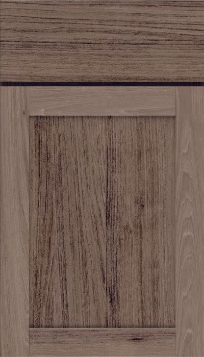 A close up of a wooden cabinet door with a black trim.