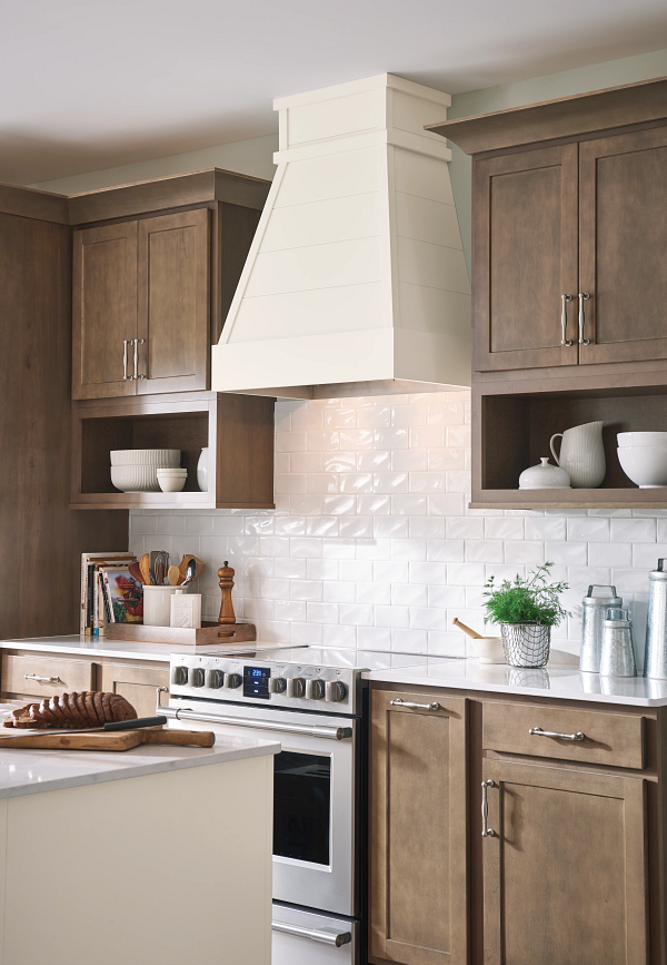 A kitchen with stainless steel appliances and wooden cabinets