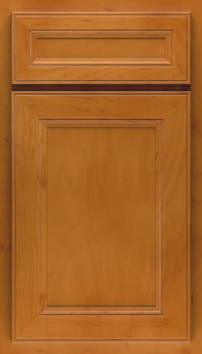 A close up of a wooden cabinet door with a black trim.