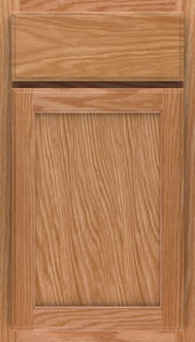 A close up of a wooden cabinet door with a drawer.