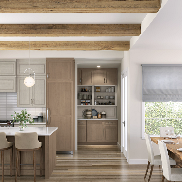 A kitchen with wooden cabinets and a table and chairs