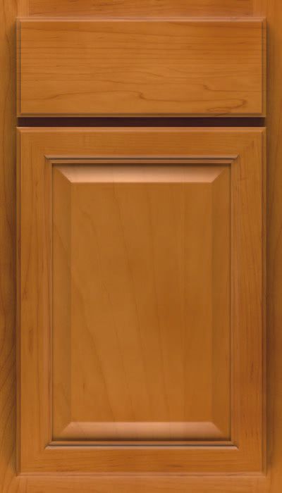 A close up of a wooden cabinet door.