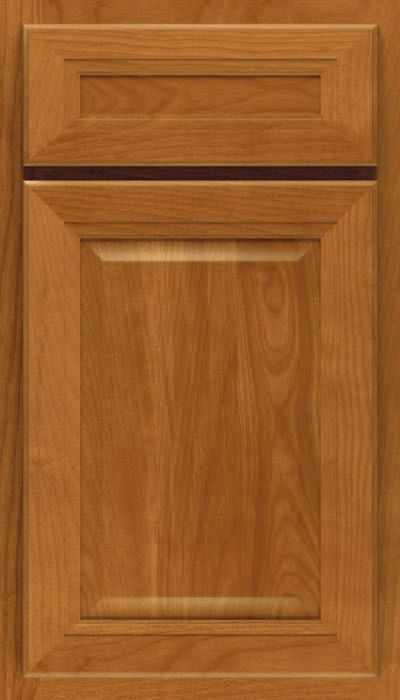 A close up of a wooden cabinet door with a black trim.