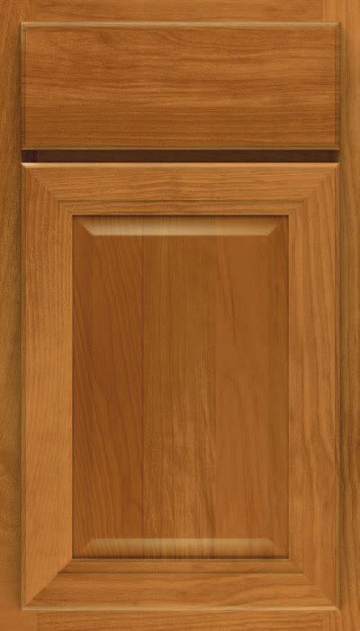 A close up of a wooden cabinet door with a black trim.