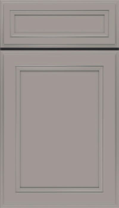 A close up of a light green cabinet door with a square frame.