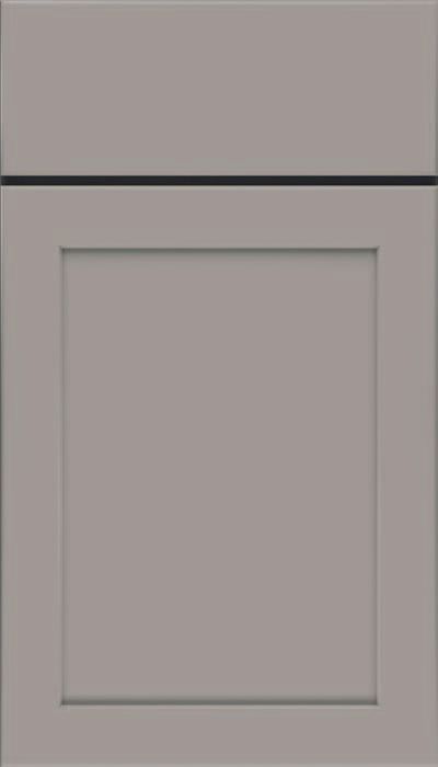 A close up of a light green cabinet door on a white background.