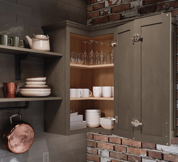 A kitchen with a copper pot hanging on the wall