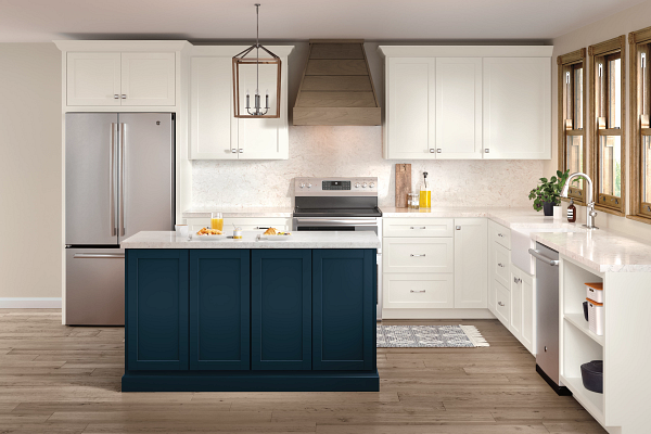 A kitchen with white cabinets and a blue island.
