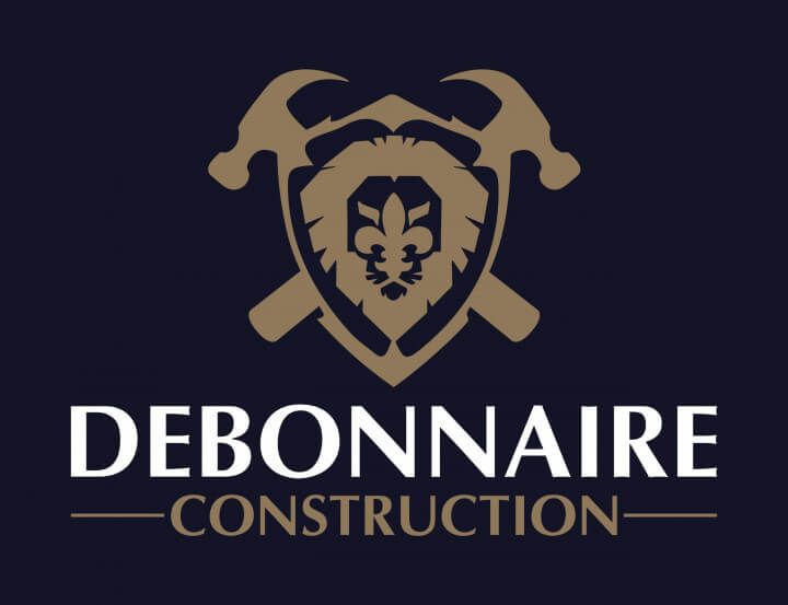 a logo for debonneire construction with a shield and hammers