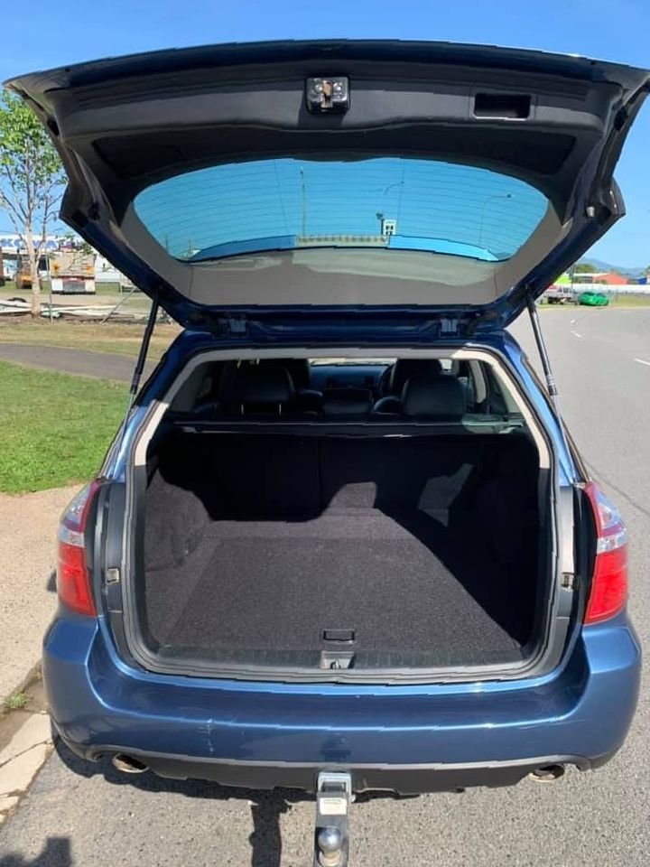 The Back Of A Blue Subaru Outback With The Trunk Open — Downsy's Cars In Bentley Park, QLD