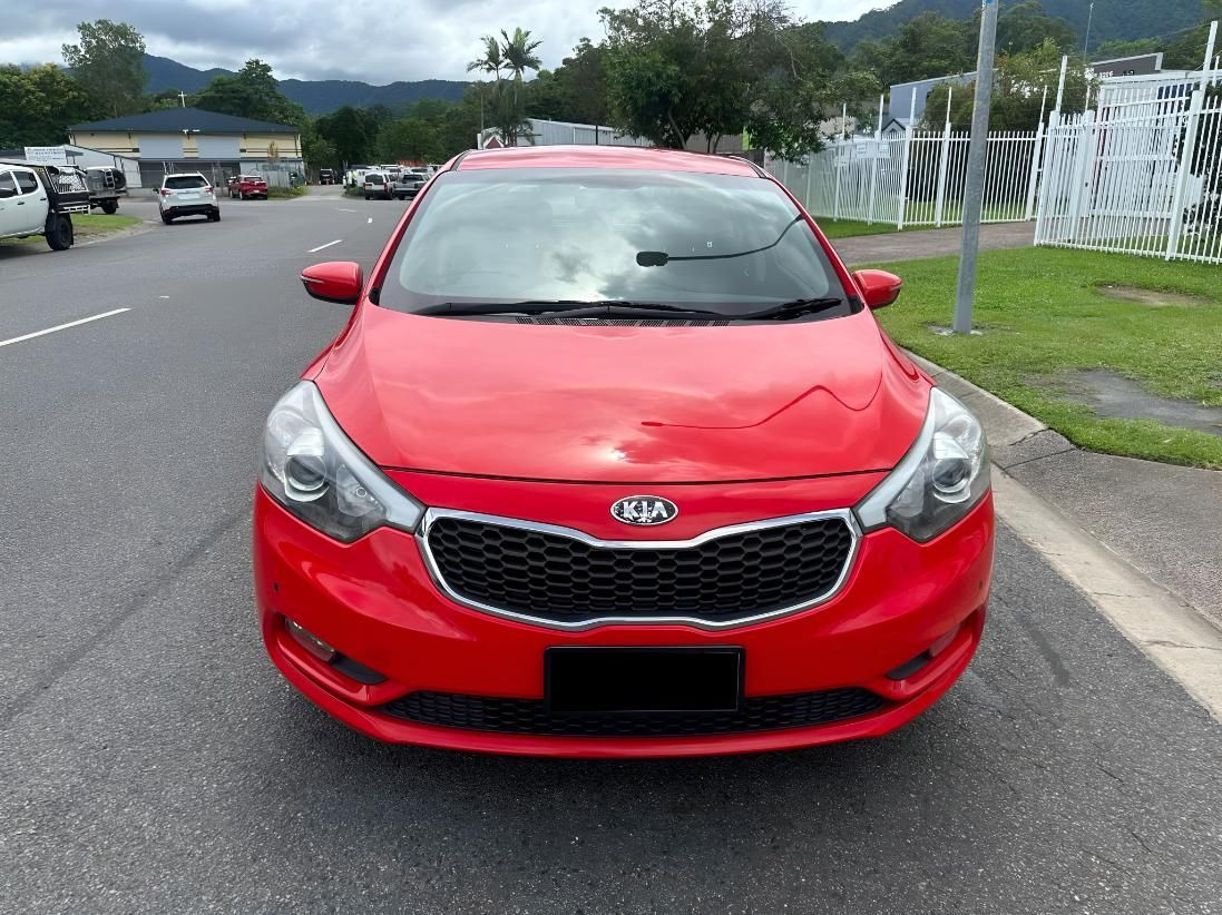 A Red Car Is Parked On The Side Of The Road — Downsy's Cars In Bentley Park, QLD