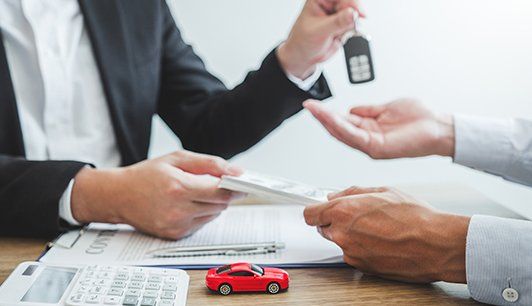 Sale Agent Giving Car Key to Customer — Corpus Christi, TX — Discount Auto Insurance of Corpus Christi
