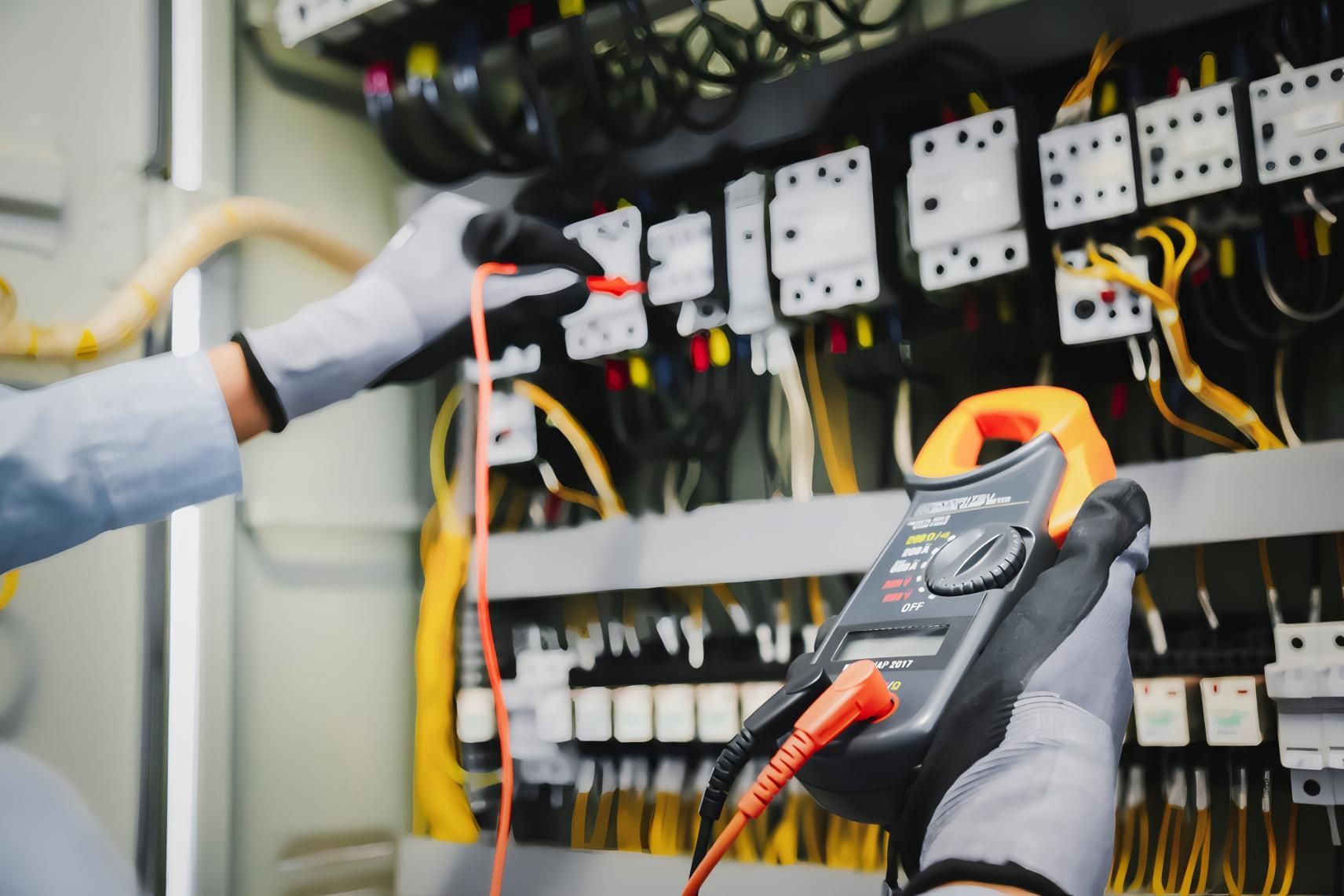 Hand Holding a Lit White Led Lightbulb — J&C Electrical Services in Eimeo, QLD