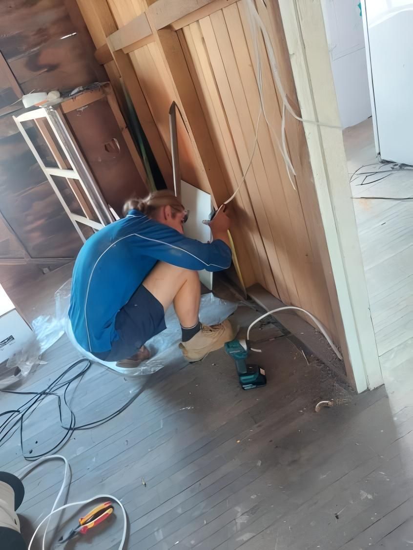 Person in Blue Working in Electricity — J&C Electrical Services in Shoal Point, QLD