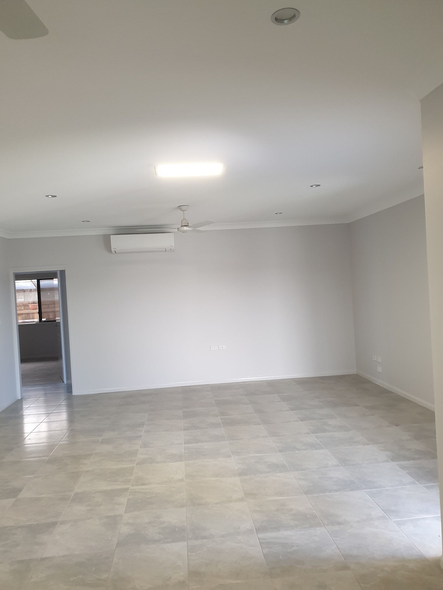 Large Room With Tiled Floor And Solar Light In The Ceiling — Insulation In Mount Louisa, QLD