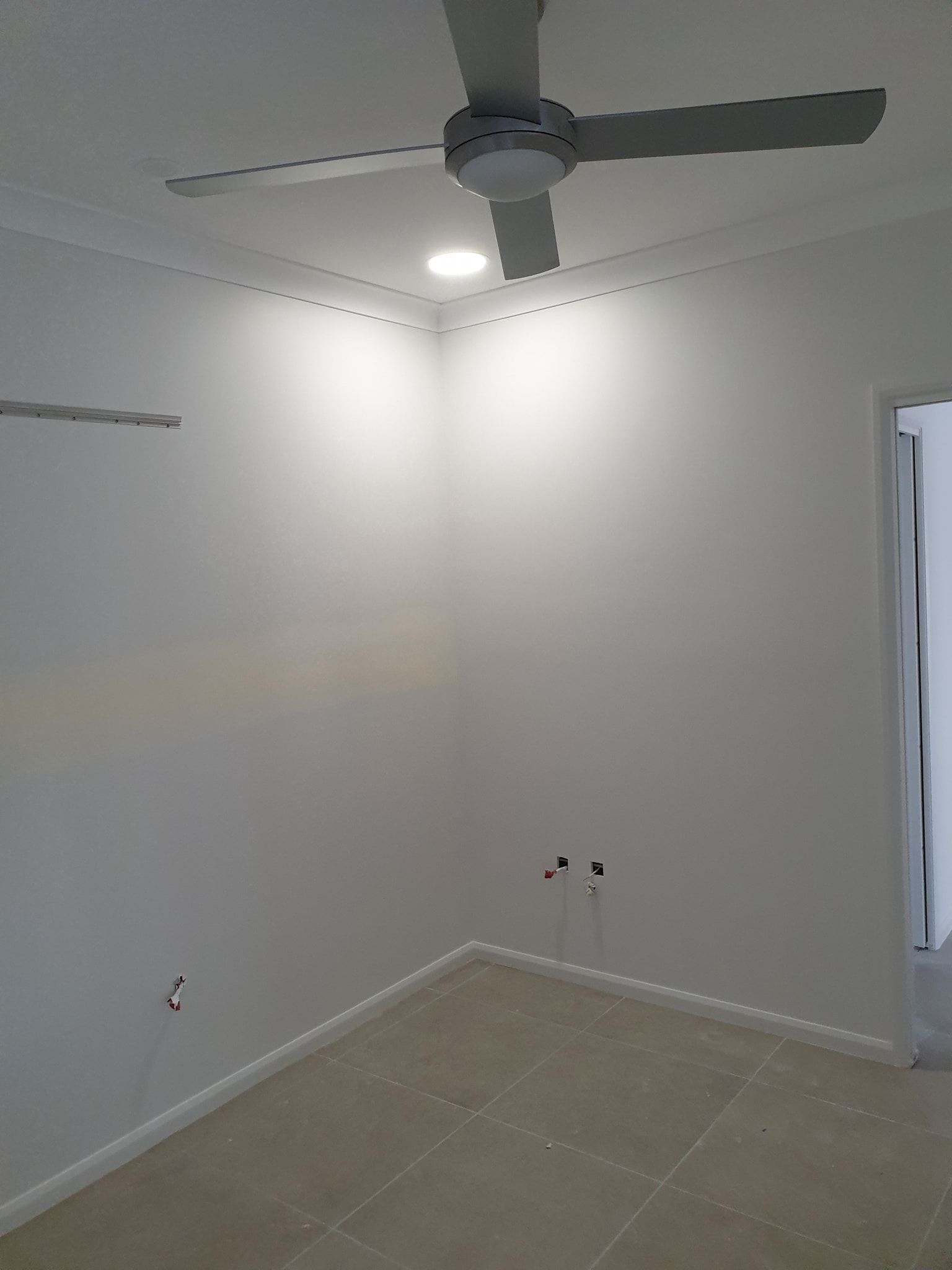 Empty Room With Light And Fan On The Ceiling — Insulation In Mount Louisa, QLD