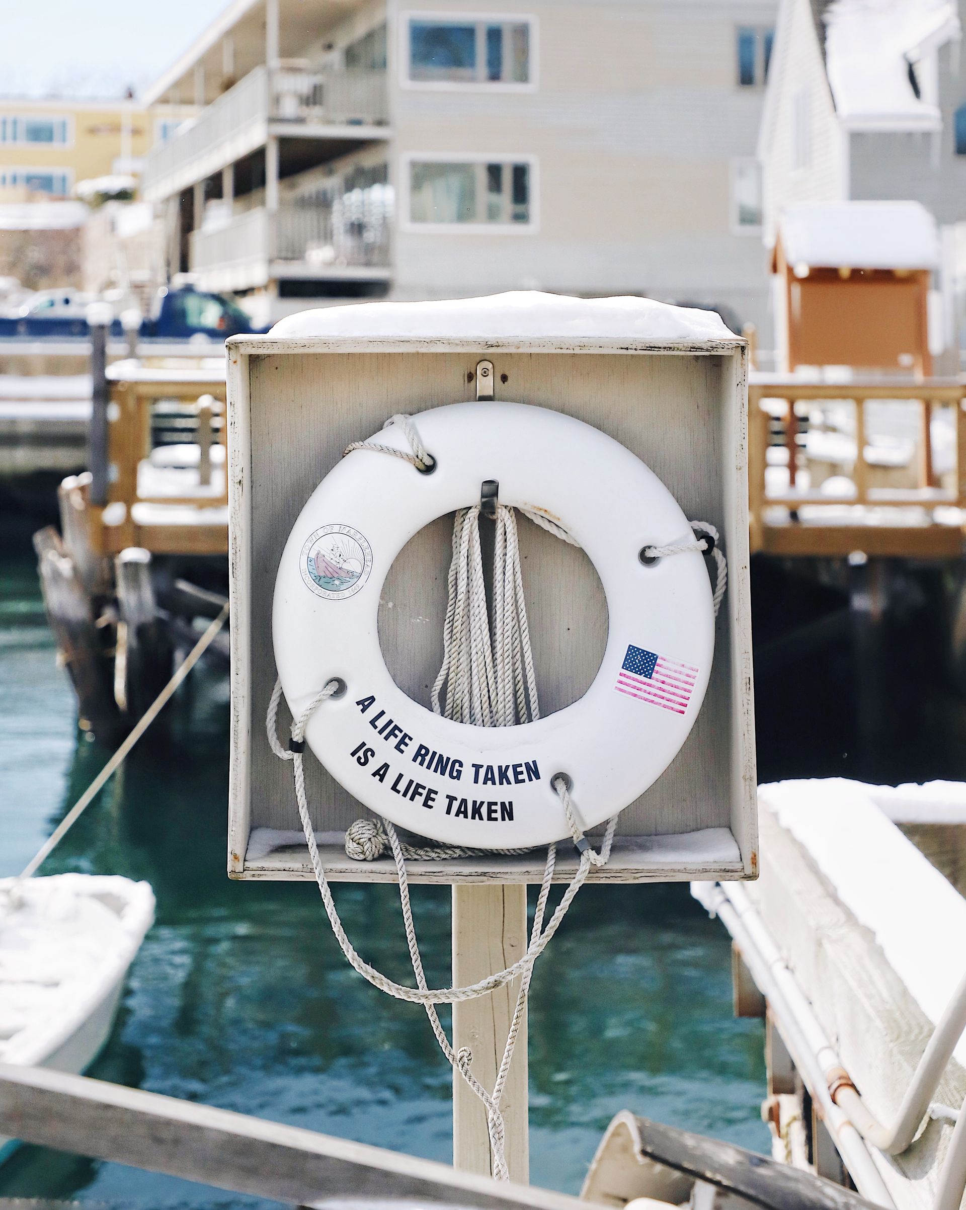 A white life ring inscribed with 