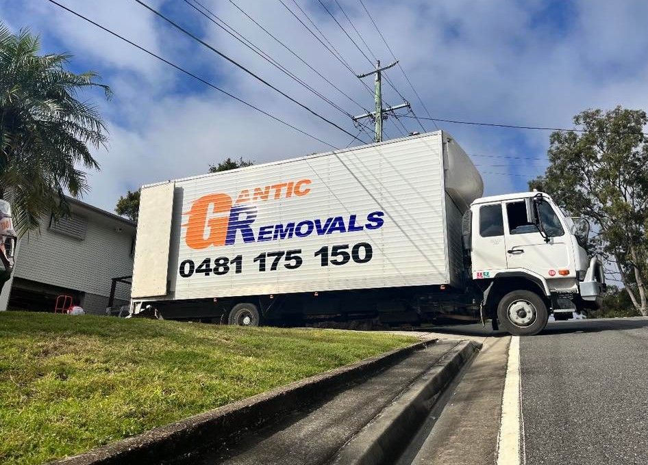 A Moving Truck is Parked on the Side of the Road — Gantic Removals & Storage in Tivoli, QLD
