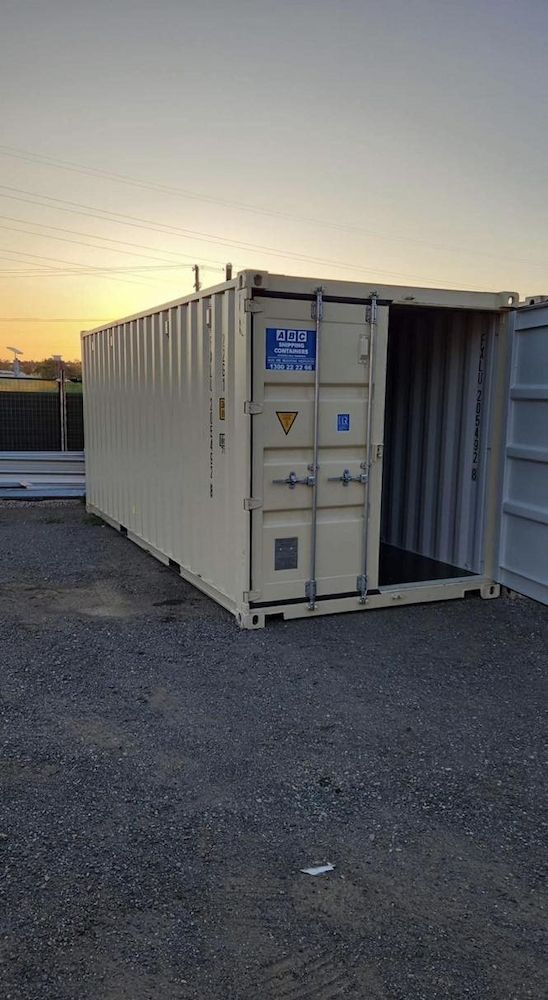 Tan Shipping Container With Open Doors on Gravel — Gantic Removals & Storage in Tivoli, QLD