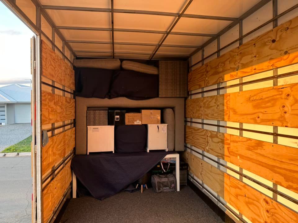 Inside of a Moving Truck Filled With Furniture and Boxes — Gantic Removals & Storage in Tivoli, QLD