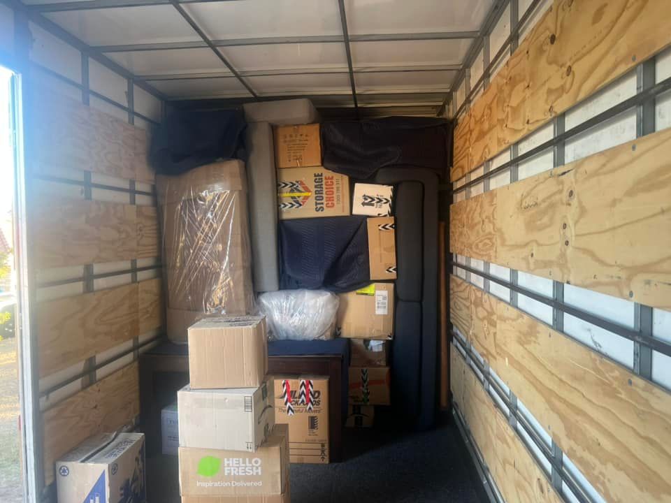 Inside of a Moving Truck Filled With Packed Boxes, and Furniture — Gantic Removals & Storage in Springfield, QLD