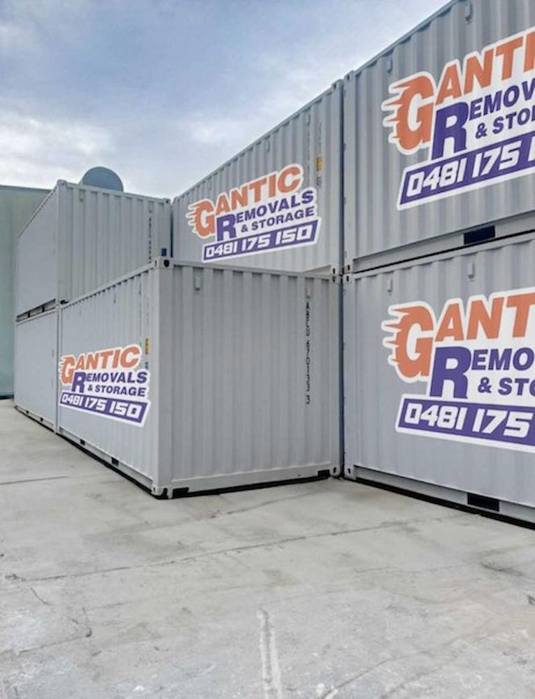 Grey Shipping Containers Stacked Outdoors — Gantic Removals & Storage in Tivoli, QLD