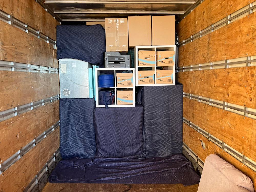Truck Interior Packed With Furniture, and Boxes Secured With Moving Blankets — Gantic Removals & Storage in Toowoomba, QLD