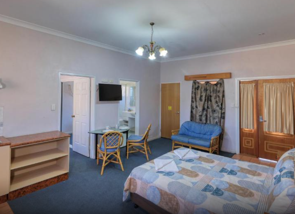 Hotel Room with Double Bed, Dining Table, and Chair — Townview Motel In Mount Isa, QLD