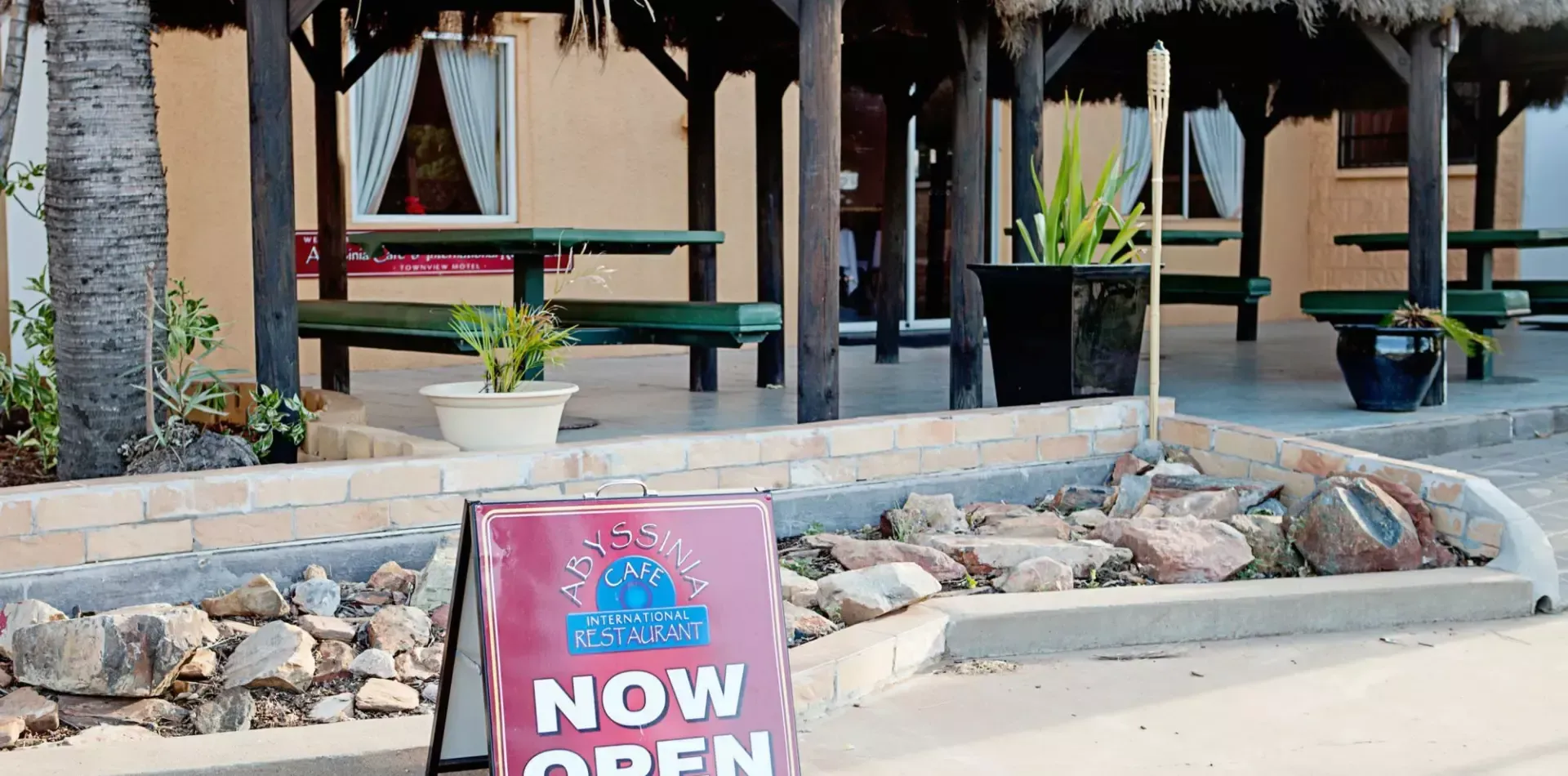 Exterior of A Restaurant with Take Away Sign at Dusk — Townview Motel In Mount Isa, QLD