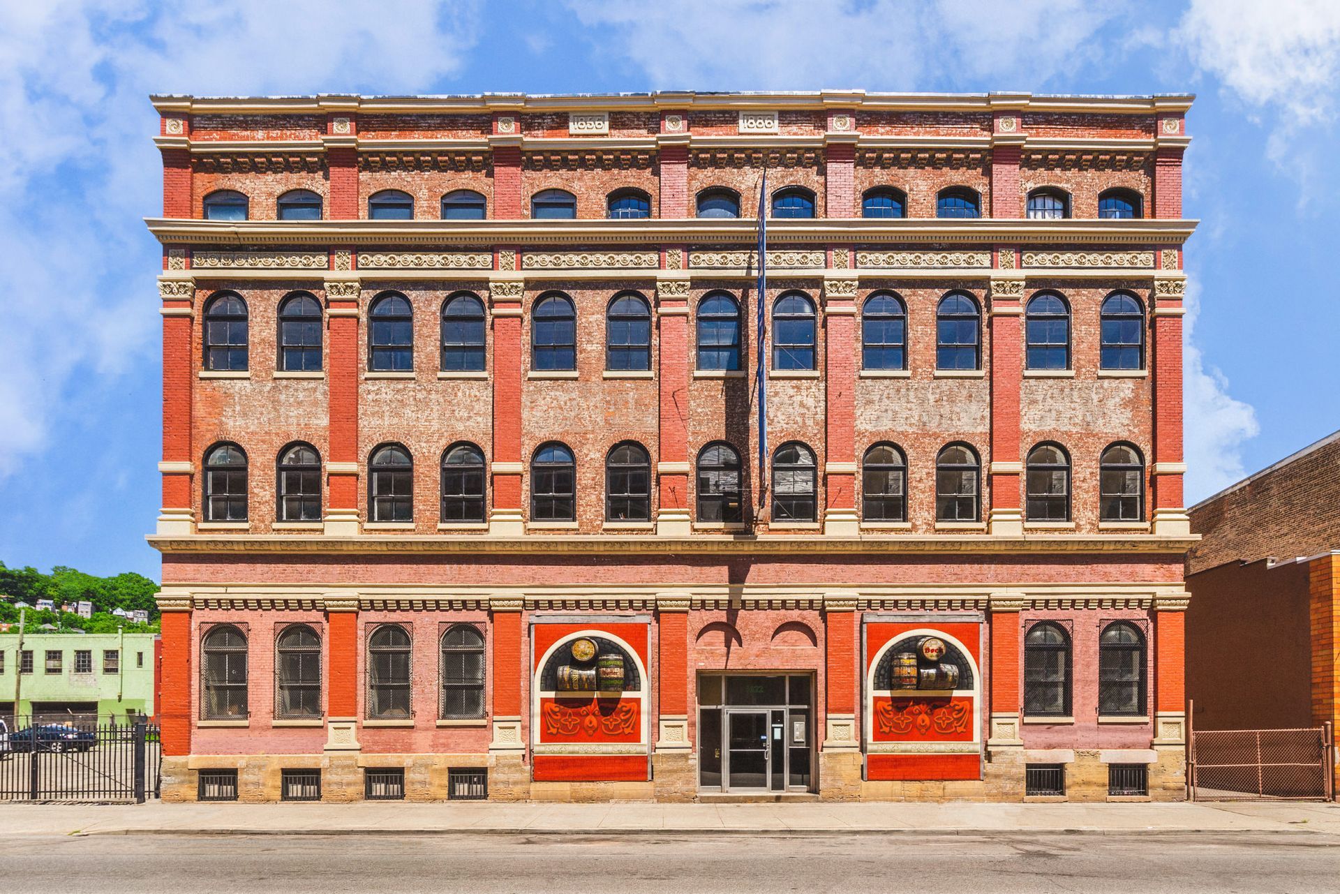 A large red brick building with a lot of windows