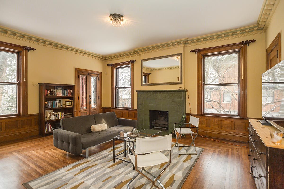 A living room with a couch and a fireplace